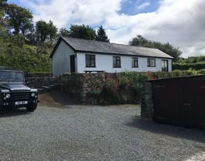 Historic town cottage at Fflicws in Beaumaris nestled near the medieval castle walls and the Victorian pier.