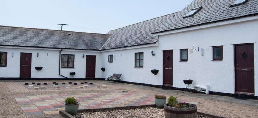 Traditional stone holiday cottages at Ty Cristion in Bodedern on the island of Ynys Môn.