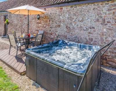Private hot tub on the patio at Court Park Barn, near Chepstow