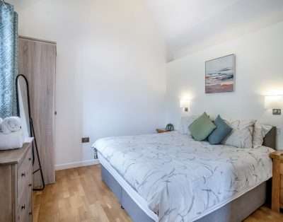 Bedroom with a king-size bed at Court Park Barn, near Chepstow
