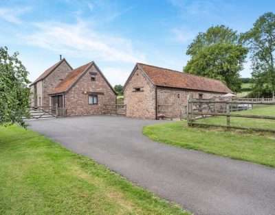 Stone barns and paddock at Court Park Barn, near Chepstow