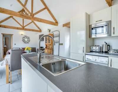 Kitchen with an island at Court Park Barn, near Chepstow