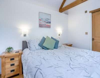 Double bedroom with exposed beams at Court Park Barn, near Chepstow