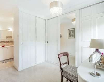 Master dressing room with fitted wardrobes and en-suite at Llwynhelig House, Vale of Glamorgan