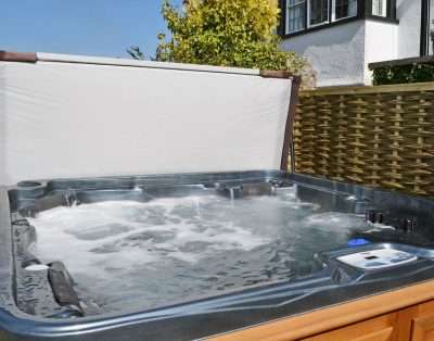 Private hot tub on the patio at The Court, near Beaumaris, Anglesey
