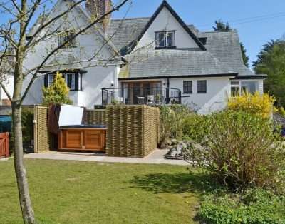 Rear of The Court with the private hot tub and garden, near Beaumaris, Anglesey