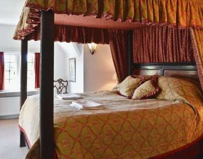 Four-poster bedroom at The Court, near Beaumaris, Anglesey