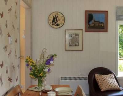 Dining corner with a pine table at The Garden House, near Monmouth
