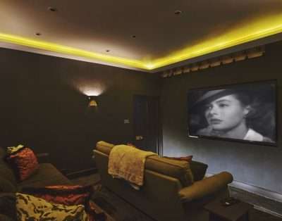 Snug media room set up for film nights at Valley Manor, Vale of Glamorgan