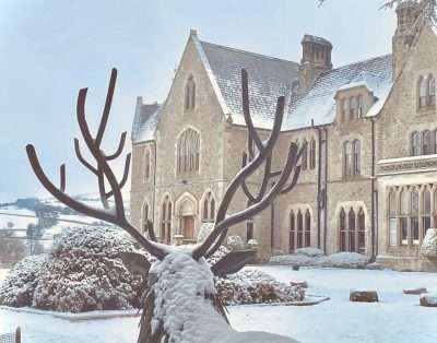 Mellington Hall in winter snow, a Victorian Gothic country house hotel in Powys